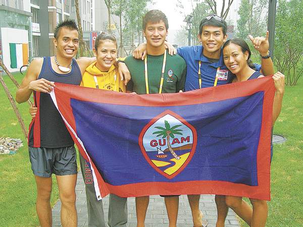 Team Guam is shown in front of their living quarters yesterday at the Athletes' Village at the 2008 Olympics in Beijing, China. From left are Derek Mandell, Maria Dunn, Chris Duenas, Sean Pangelinan and Cora Alicto. Not shown is Ric "R.J." Blas Jr. (Jojo Santo Tomas/Pacific Daily News/santotomas@gua)