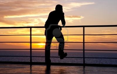 456464-thinking-man-silhouette-and-red-sunset-on-a-ferry