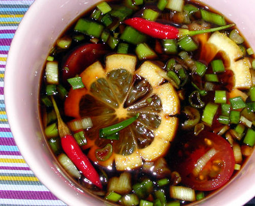 Finadene, pronounced fin-ah-dén-ee, is a dipping sauce for meats, poultry, fish, and rice that is always found at fiestas and markets or can be made easily at home. It consists of one part soy sauce, one part vinegar, lemon, pepper, chopped onions, and fresh chilies (for those who prefer a more spicy sauce) and is best when served chilled. A local would call finadene an integral part to any fiesta.