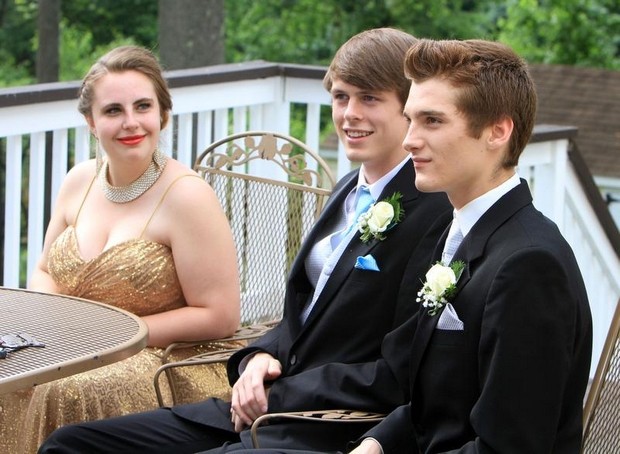 Frank Becerra Jr./The Journal News From left, Chelsea Blaney listens as her friends Dylan Meehan and Brad Taylor talk about being voted the "cutest couple" in the Carmel High School yearbook June 3, 2013. Meehan and Taylor gathered with friends for pre-prom photos at a home in Patterson. ( Frank Becerra Jr / The Journal News )