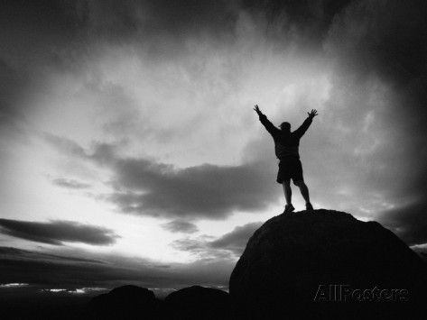 kevin-lange-silhouette-man-arms-raised-into-the-new-mexico-sky-in-black-and-white